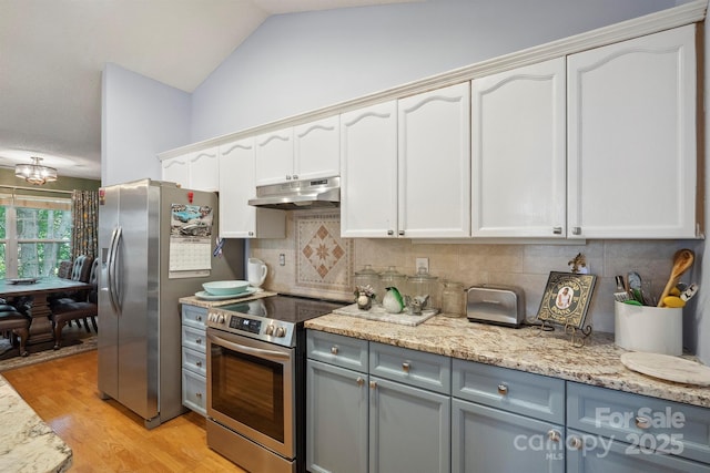 119 Ashwood Ln, Mooresville, NC 28117 - kitchen featuring stainless steel appliances, under cabinet range hood, tasteful backsplash, light wood finished floors, and light stone countertops