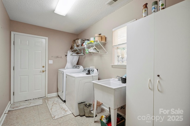 119 Ashwood Ln, Mooresville, NC 28117 - laundry area featuring washer and clothes dryer and a textured ceiling