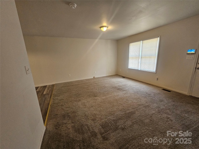 606 N St, Belmont, NC 28012 - carpeted spare room with baseboards and a smoke detector