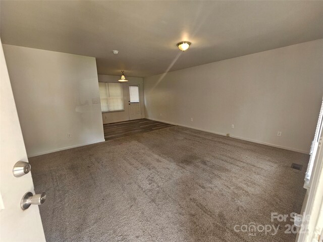 606 N St, Belmont, NC 28012 - unfurnished room featuring dark carpet and baseboards