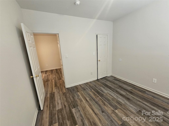 606 N St, Belmont, NC 28012 - unfurnished room with dark wood-style floors and a smoke detector