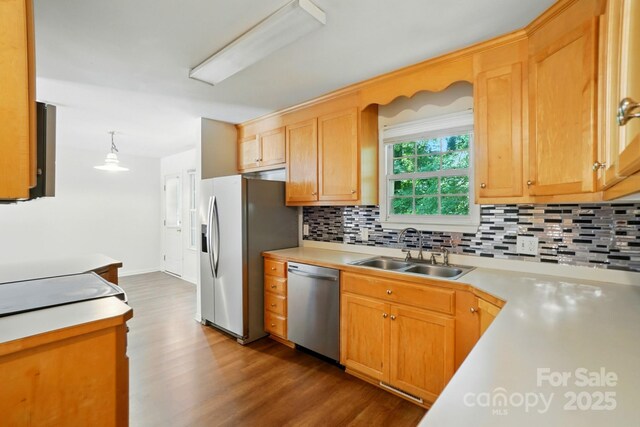 606 N St, Belmont, NC 28012 - kitchen with stainless steel appliances, dark wood-style flooring, decorative backsplash, light countertops, and pendant lighting