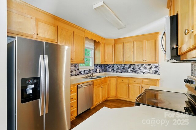606 N St, Belmont, NC 28012 - kitchen featuring stainless steel appliances, light brown cabinetry, backsplash, and light countertops