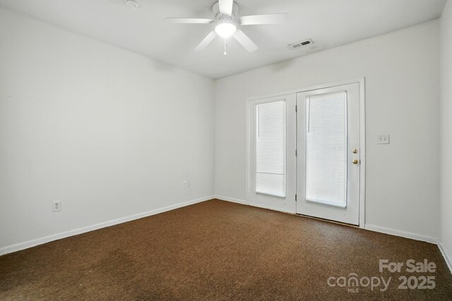606 N St, Belmont, NC 28012 - spare room with dark colored carpet and ceiling fan
