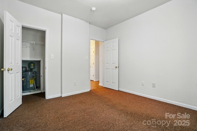 606 N St, Belmont, NC 28012 - unfurnished bedroom featuring carpet and baseboards