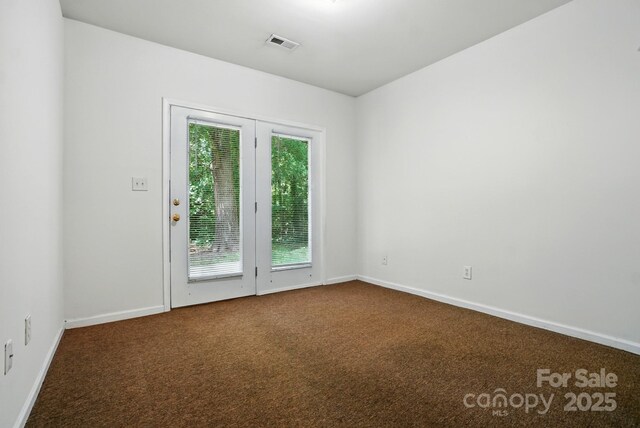 606 N St, Belmont, NC 28012 - spare room featuring dark colored carpet