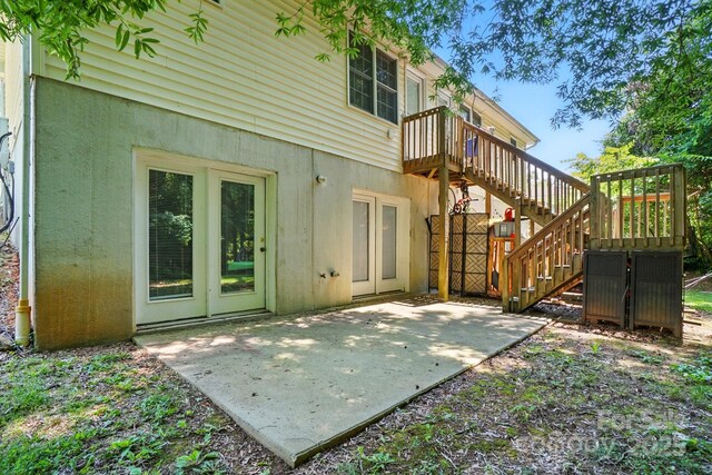 606 N St, Belmont, NC 28012 - rear view of house with stairway, stucco siding, and a wooden deck