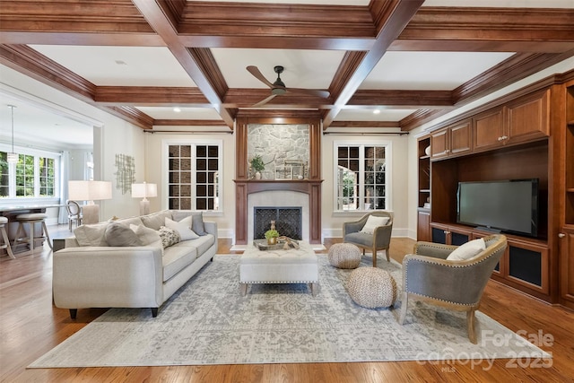 3032 Kings Manor Dr, Matthews, NC 28104 - living area featuring a ceiling fan, a fireplace, wood finished floors, beam ceiling, and coffered ceiling