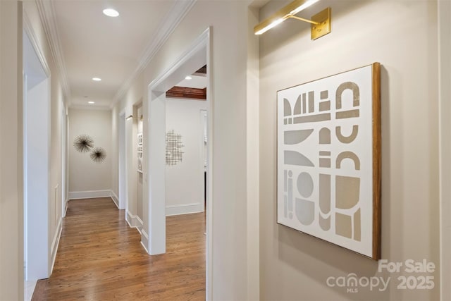3032 Kings Manor Dr, Matthews, NC 28104 - hall with wood finished floors, ornamental molding, and recessed lighting