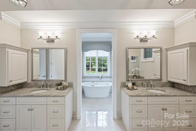 3032 Kings Manor Dr, Matthews, NC 28104 - bathroom featuring crown molding, two vanities, and a freestanding bath