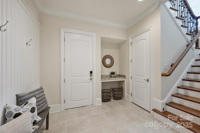 3032 Kings Manor Dr, Matthews, NC 28104 - mudroom featuring crown molding and baseboards