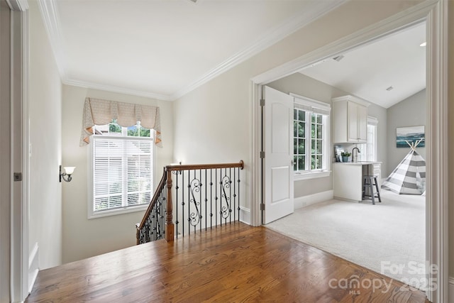 3032 Kings Manor Dr, Matthews, NC 28104 - corridor featuring an upstairs landing, wood finished floors, ornamental molding, lofted ceiling, and carpet flooring