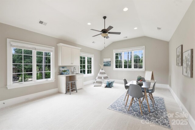 3032 Kings Manor Dr, Matthews, NC 28104 - dining room with light colored carpet, ceiling fan, vaulted ceiling, and recessed lighting