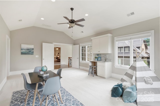 3032 Kings Manor Dr, Matthews, NC 28104 - dining area featuring a ceiling fan, vaulted ceiling, and recessed lighting