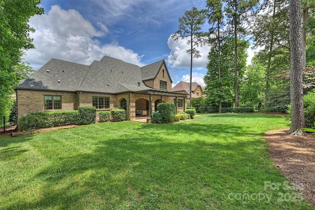 3032 Kings Manor Dr, Matthews, NC 28104 - back of property with brick siding and a lawn
