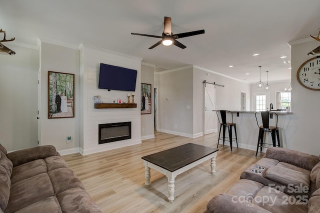 1202 Neds Creek Rd, Kershaw, SC 29067 - living room featuring a barn door, a ceiling fan, recessed lighting, light wood finished floors, and baseboards