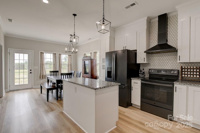 1202 Neds Creek Rd, Kershaw, SC 29067 - kitchen with wall chimney exhaust hood, black range with electric cooktop, refrigerator with ice dispenser, a center island, and tasteful backsplash