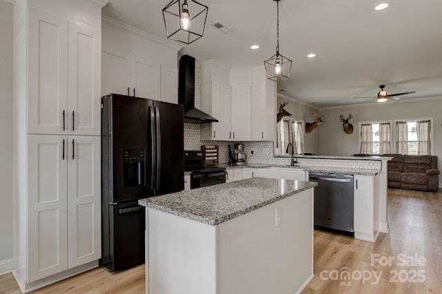 1202 Neds Creek Rd, Kershaw, SC 29067 - kitchen featuring wall chimney exhaust hood, black appliances, a peninsula, open floor plan, and a ceiling fan