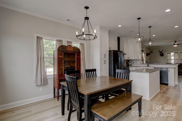 1202 Neds Creek Rd, Kershaw, SC 29067 - dining room featuring plenty of natural light, a chandelier, crown molding, ceiling fan, and light wood finished floors