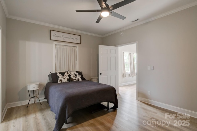 1202 Neds Creek Rd, Kershaw, SC 29067 - bedroom with light wood-type flooring, baseboards, ornamental molding, and a ceiling fan