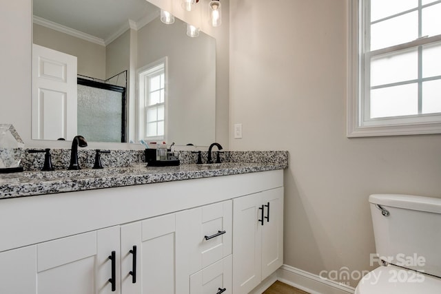 1202 Neds Creek Rd, Kershaw, SC 29067 - bathroom with double vanity, ornamental molding, a shower with door, toilet, and baseboards