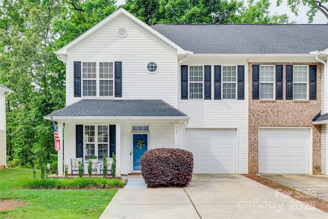 727 Torrey Pines Ln, Fort Mill, SC 29715 - view of front of home featuring driveway, a garage, covered porch, and roof with shingles
