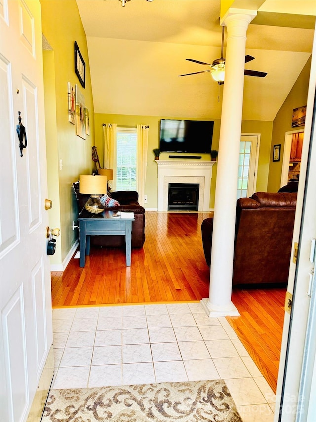 104 Laura Ct, Cherryville, NC 28021 - living area with decorative columns, wood finished floors, lofted ceiling, ceiling fan, and a fireplace