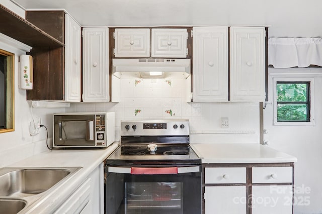 68 Cornwell Dr, Waynesville, NC 28786 - kitchen with stainless steel appliances, under cabinet range hood, light countertops, and tasteful backsplash