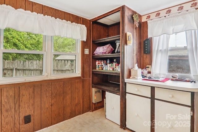 68 Cornwell Dr, Waynesville, NC 28786 - kitchen featuring wood walls, light floors, healthy amount of natural light, and light countertops