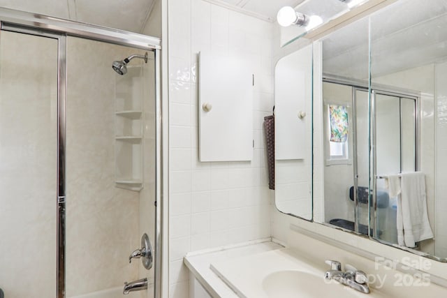 68 Cornwell Dr, Waynesville, NC 28786 - bathroom with tile walls, vanity, and combined bath / shower with glass door