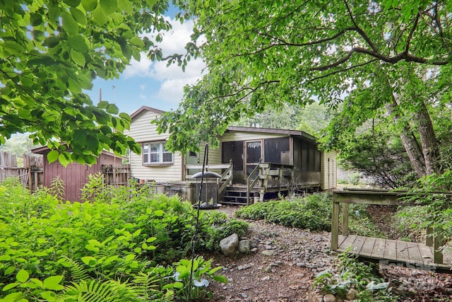 68 Cornwell Dr, Waynesville, NC 28786 - back of house with a sunroom and a wooden deck