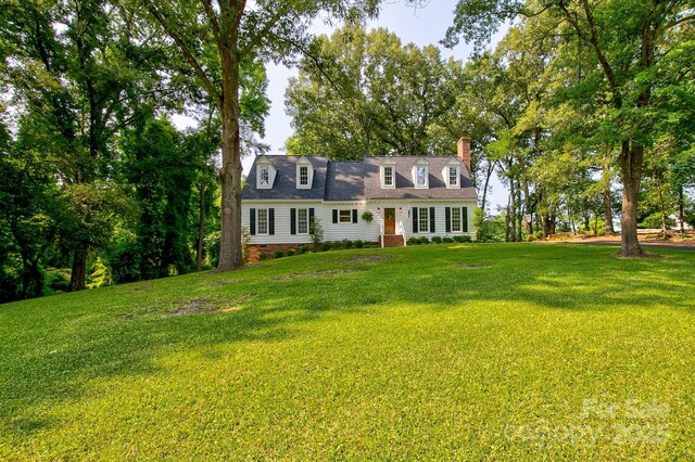 325 Chapman St, Chesterfield, SC 29709 - cape cod house featuring a chimney, a front lawn, and crawl space
