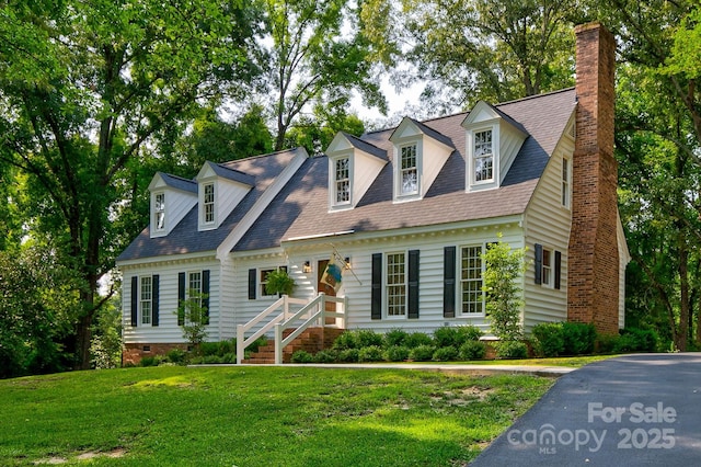 325 Chapman St, Chesterfield, SC 29709 - cape cod home featuring a front lawn, a chimney, and roof with shingles