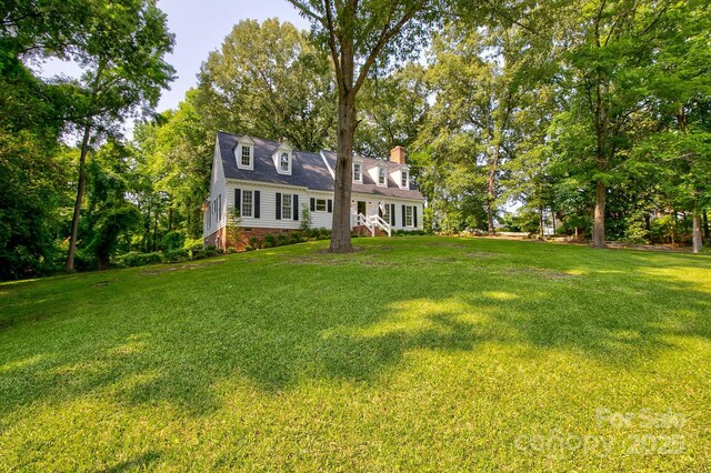 325 Chapman St, Chesterfield, SC 29709 - new england style home featuring a front lawn, crawl space, and a chimney
