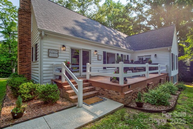 325 Chapman St, Chesterfield, SC 29709 - cape cod home with a shingled roof, a wooden deck, and a chimney