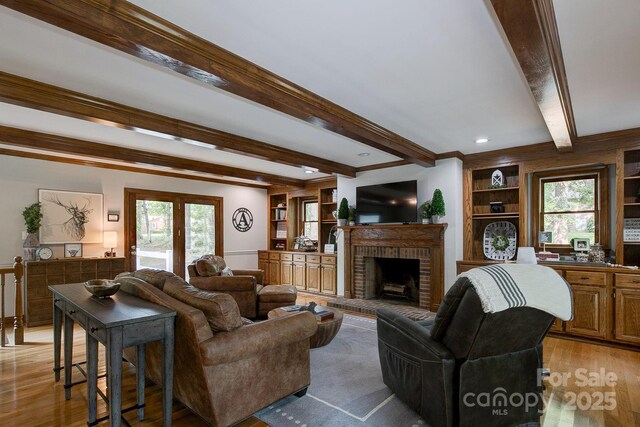 325 Chapman St, Chesterfield, SC 29709 - living area featuring beamed ceiling, light wood finished floors, a brick fireplace, and built in features