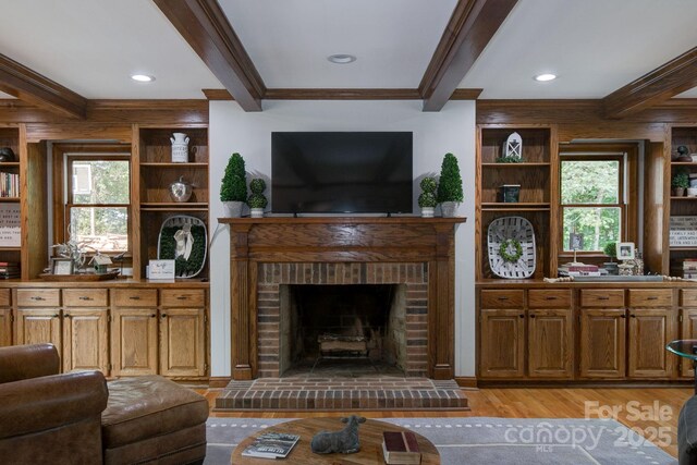 325 Chapman St, Chesterfield, SC 29709 - living area featuring light wood finished floors, beam ceiling, plenty of natural light, a fireplace, and crown molding