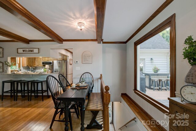 325 Chapman St, Chesterfield, SC 29709 - dining area with light wood finished floors, beamed ceiling, and ornamental molding