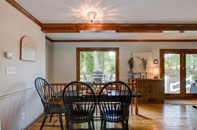 325 Chapman St, Chesterfield, SC 29709 - dining area with healthy amount of natural light, light wood-type flooring, and beam ceiling