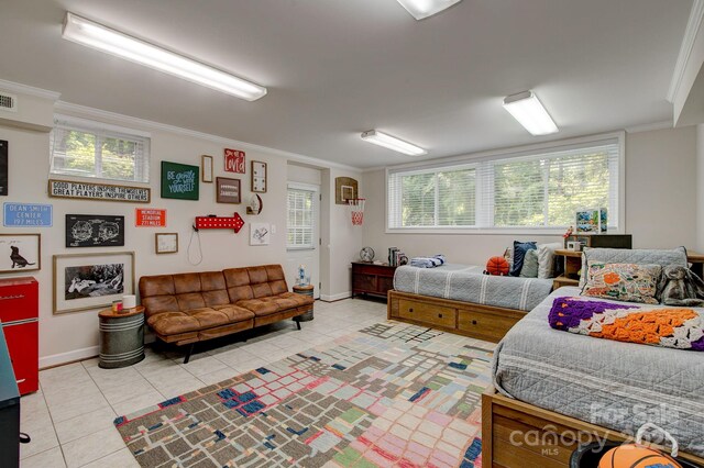 325 Chapman St, Chesterfield, SC 29709 - bedroom with light tile patterned floors, crown molding, multiple windows, and baseboards