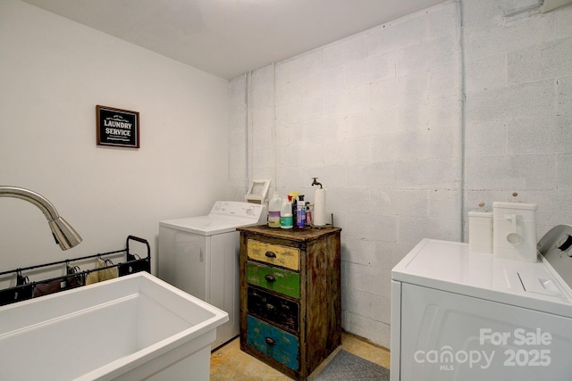 325 Chapman St, Chesterfield, SC 29709 - washroom featuring separate washer and dryer, a sink, and concrete block wall