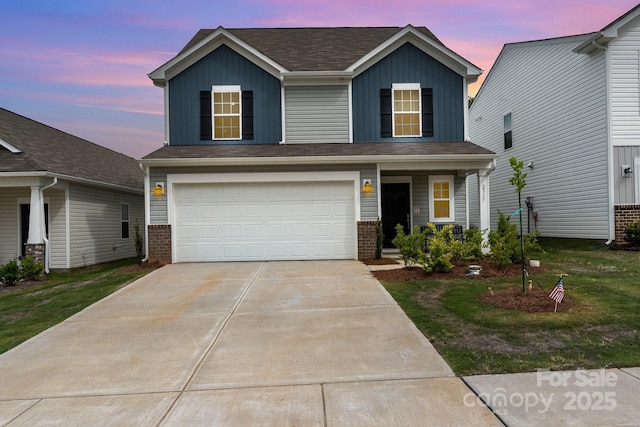 2317 Trollinger Dr, Catawba, NC 28609 - traditional-style house with brick siding, concrete driveway, an attached garage, and board and batten siding