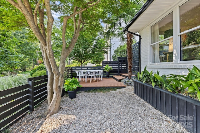 2424 Cumberland Ave, Charlotte, NC 28203 - view of yard featuring a wooden deck and outdoor dining area