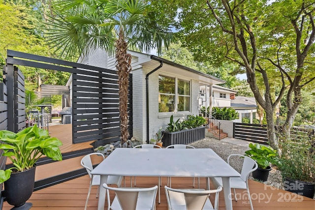 2424 Cumberland Ave, Charlotte, NC 28203 - wooden terrace with outdoor dining area and area for grilling