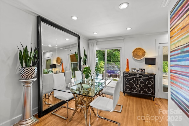 2424 Cumberland Ave, Charlotte, NC 28203 - dining area with wood finished floors, recessed lighting, and ornamental molding