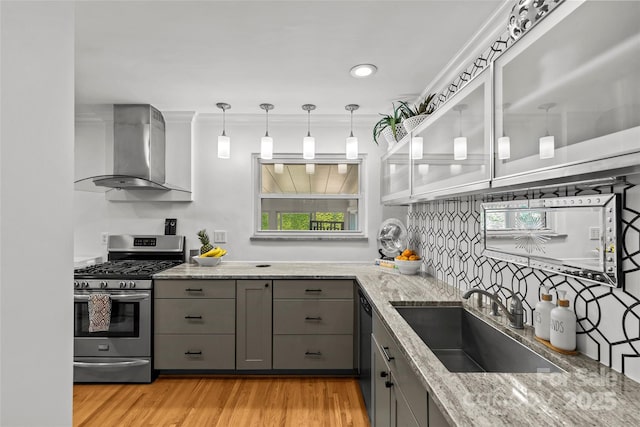 2424 Cumberland Ave, Charlotte, NC 28203 - kitchen with stainless steel gas range oven, gray cabinetry, ventilation hood, and a sink