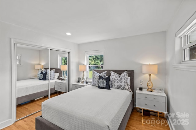 2424 Cumberland Ave, Charlotte, NC 28203 - bedroom with light wood-type flooring, a closet, and recessed lighting