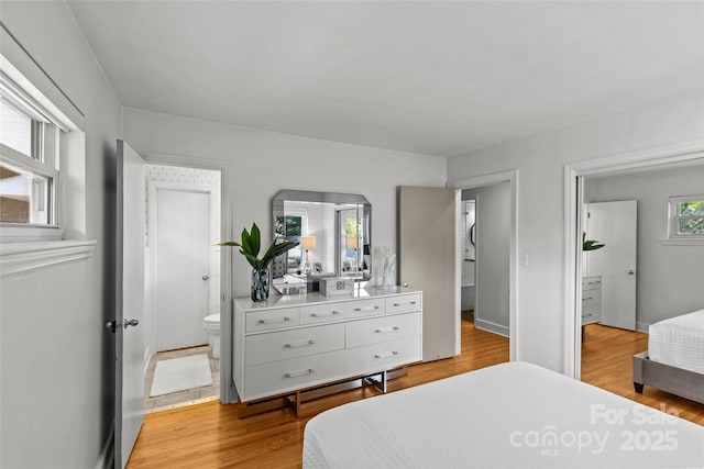2424 Cumberland Ave, Charlotte, NC 28203 - bedroom featuring light wood-type flooring and ensuite bathroom