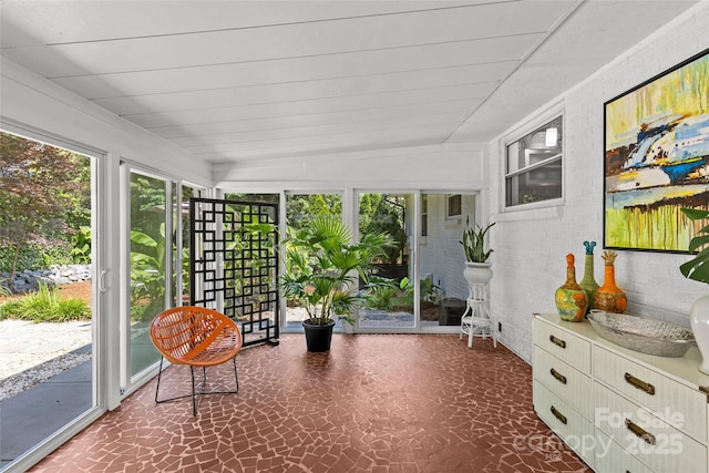2424 Cumberland Ave, Charlotte, NC 28203 - sunroom / solarium featuring healthy amount of natural light, brick wall, and tile patterned floors