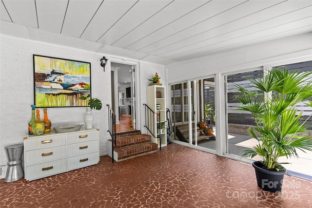2424 Cumberland Ave, Charlotte, NC 28203 - sitting room featuring stairway and brick wall